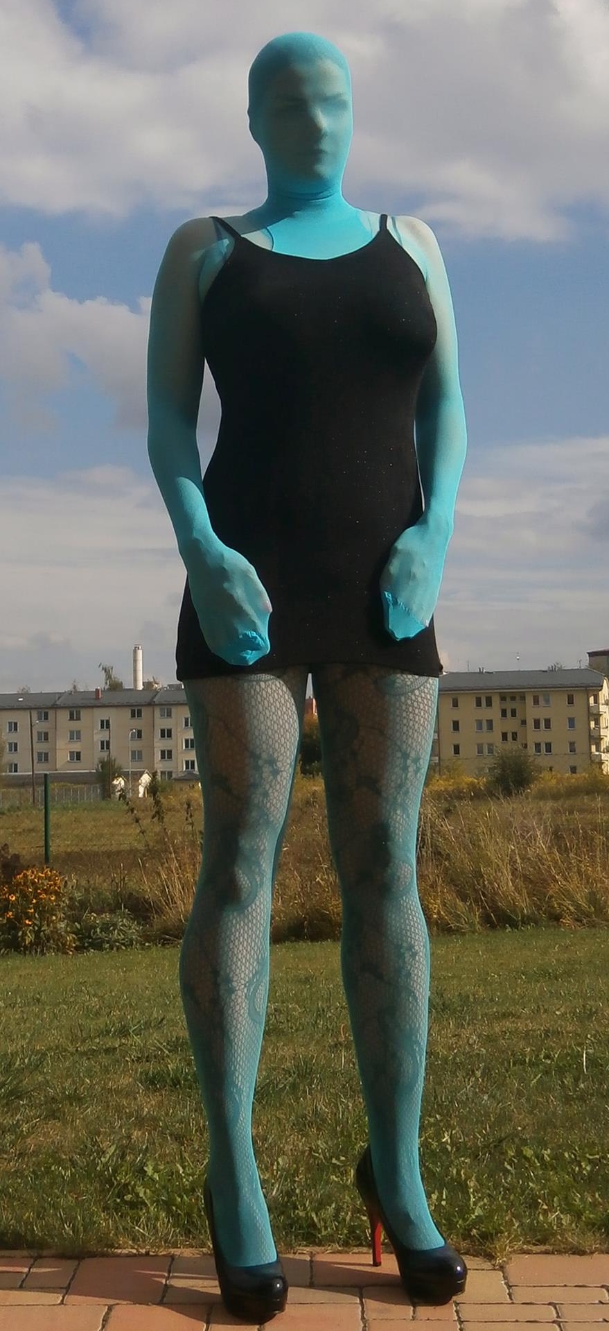 Girl Totally encased in Blue Opaque Lycra Pantyhose wearing Black High Heels and Short Dress